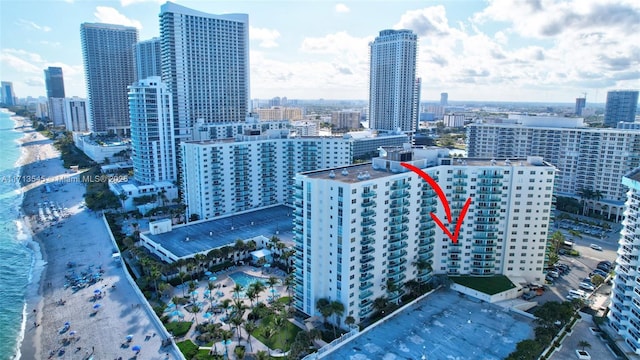 property's view of city with a water view and a view of the beach