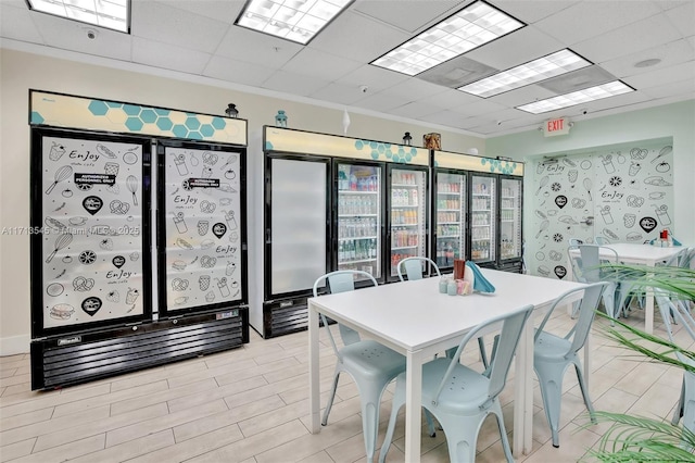 dining area with a paneled ceiling