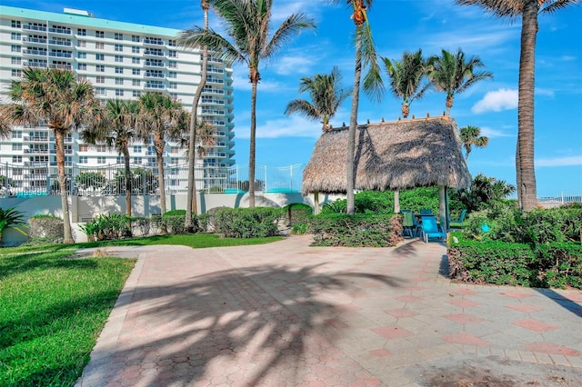 surrounding community with a gazebo and a patio area