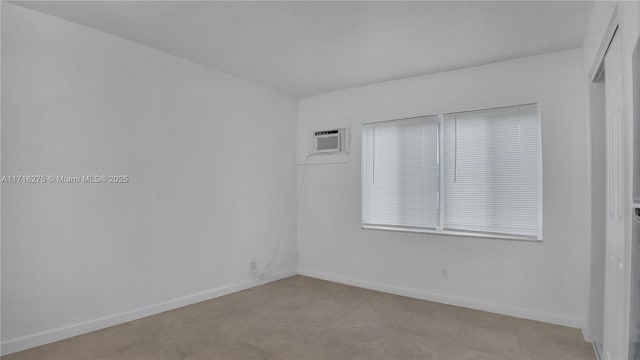 unfurnished room with a wall mounted AC