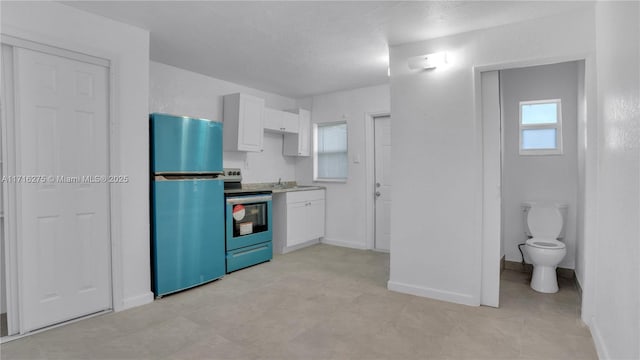 kitchen featuring white cabinetry, sink, and stainless steel appliances