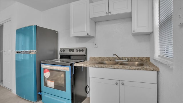 kitchen with white cabinetry, sink, and appliances with stainless steel finishes