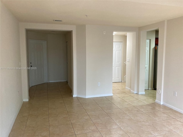 empty room featuring light tile patterned floors