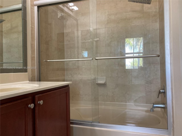 bathroom featuring vanity and enclosed tub / shower combo