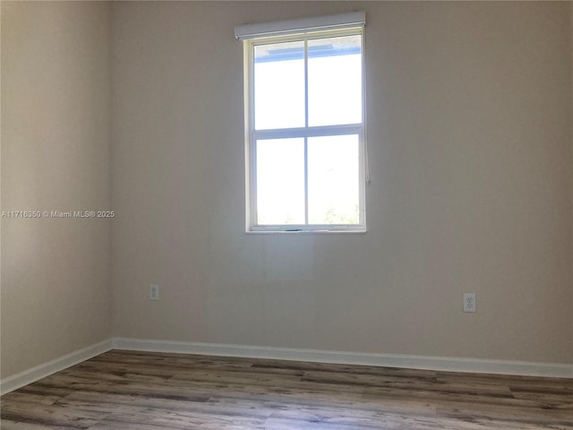 empty room featuring hardwood / wood-style flooring