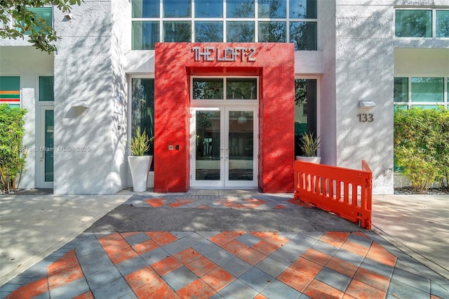 property entrance featuring french doors