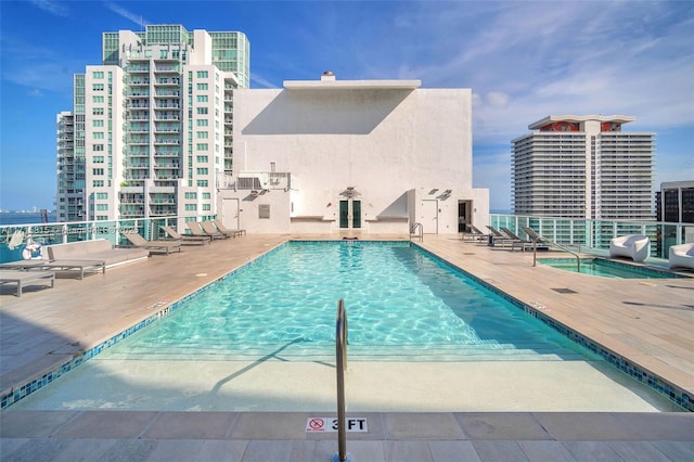 view of swimming pool featuring a patio