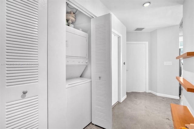 laundry room featuring stacked washer and clothes dryer