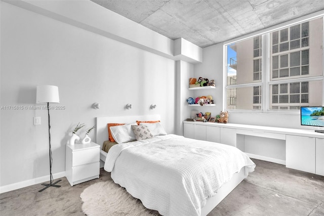 bedroom with concrete floors