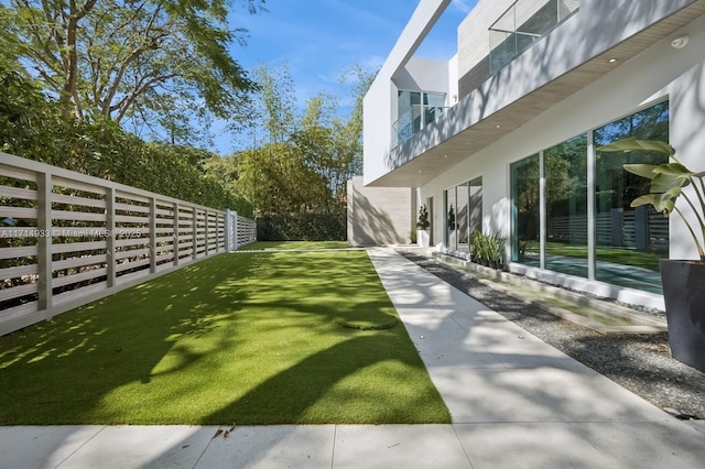 view of yard with a fenced backyard