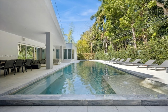 pool featuring a patio