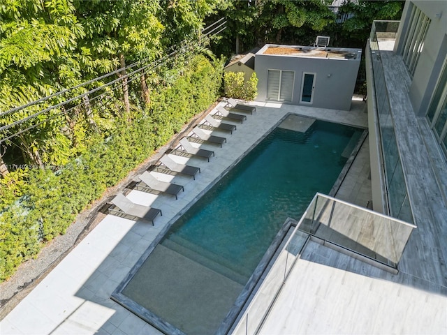 outdoor pool featuring a patio