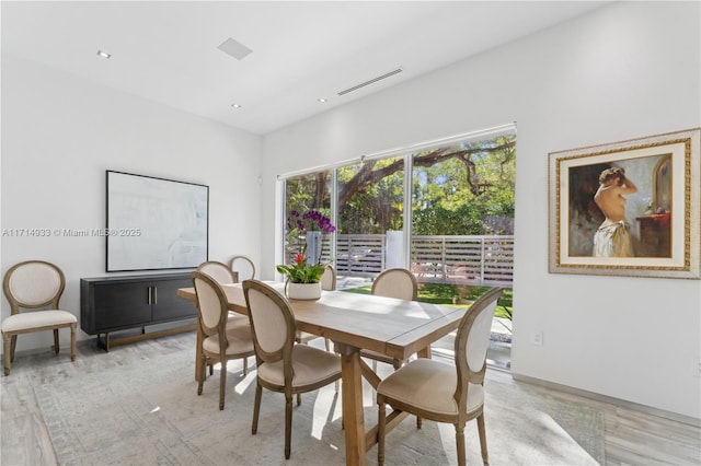 dining space featuring visible vents, recessed lighting, and light wood finished floors