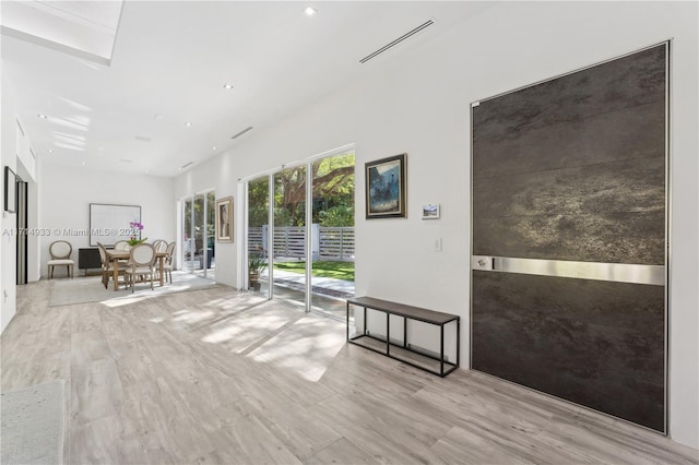 interior space with visible vents and wood finished floors
