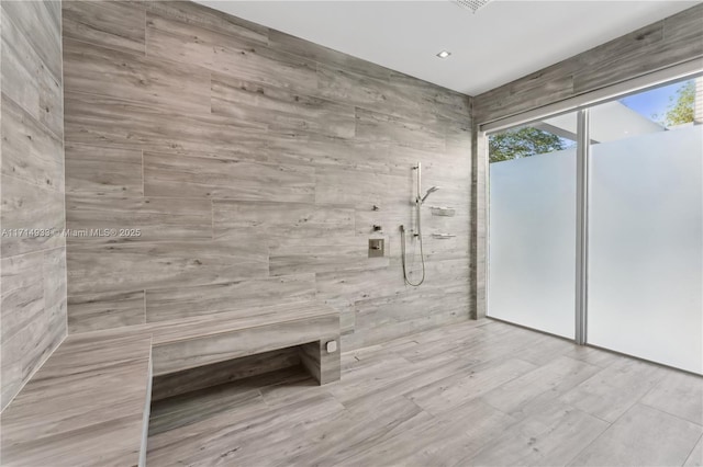 bathroom featuring tiled shower