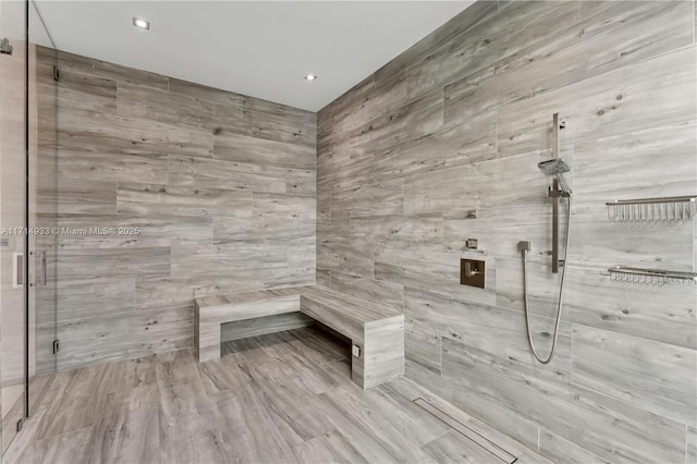 full bath featuring a shower stall and a sauna