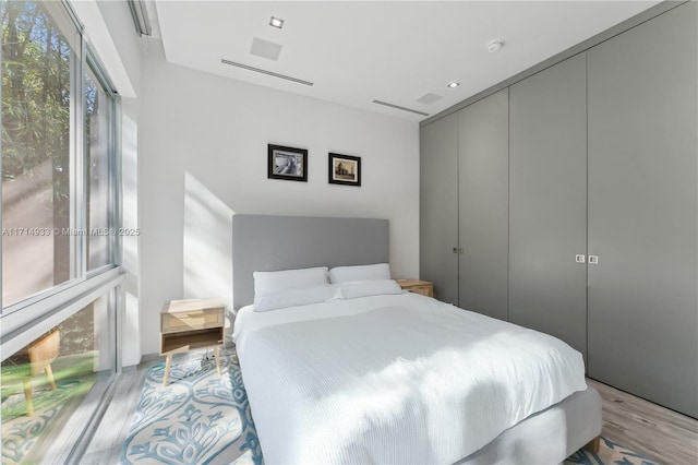 bedroom with a closet and wood finished floors