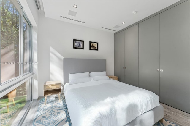 bedroom featuring a closet and wood finished floors