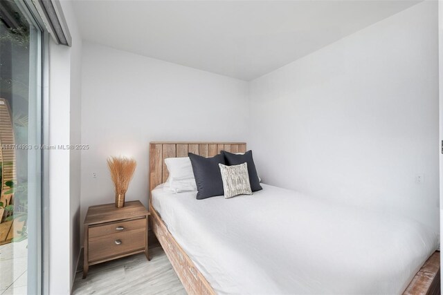 bedroom with light wood-style floors