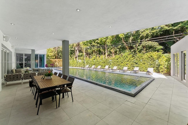 view of patio / terrace with an outdoor hangout area and an outdoor pool