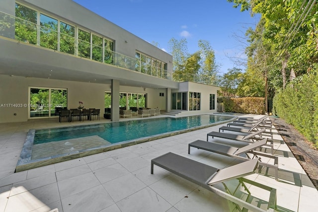 pool with a patio area