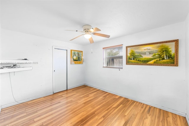 unfurnished room featuring ceiling fan and light hardwood / wood-style flooring