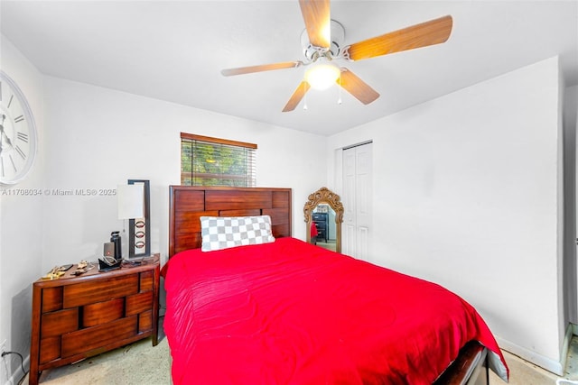 bedroom with ceiling fan and a closet