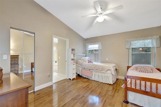 bedroom featuring ceiling fan, vaulted ceiling, and light hardwood / wood-style flooring