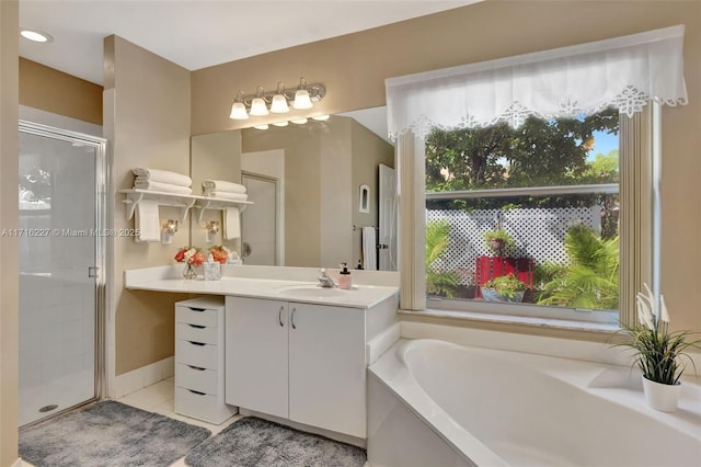 bathroom with tile patterned flooring, vanity, and plus walk in shower