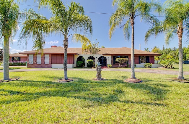 ranch-style house with a front yard