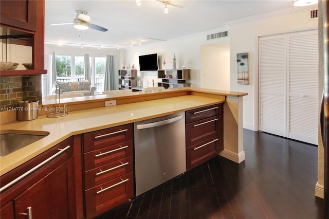 kitchen featuring dishwasher, dark wood-type flooring, rail lighting, crown molding, and ceiling fan