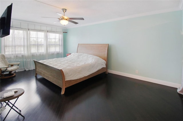 bedroom featuring ceiling fan, dark hardwood / wood-style floors, and ornamental molding