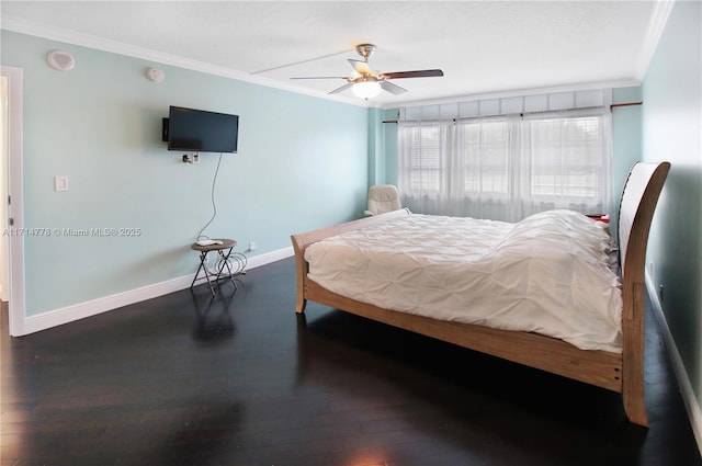 bedroom featuring ceiling fan, dark wood-type flooring, crown molding, and multiple windows