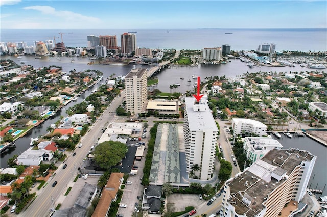 birds eye view of property with a water view