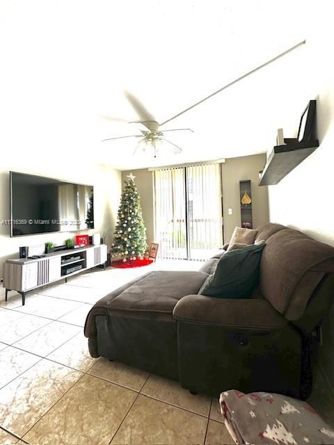 tiled bedroom with ceiling fan