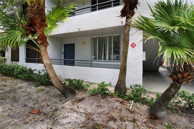 doorway to property featuring a balcony