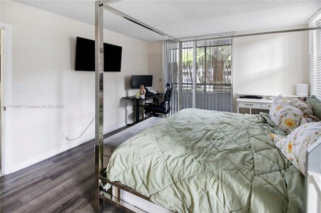 bedroom featuring dark hardwood / wood-style flooring