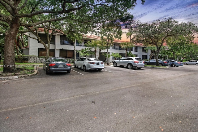 view of parking at dusk