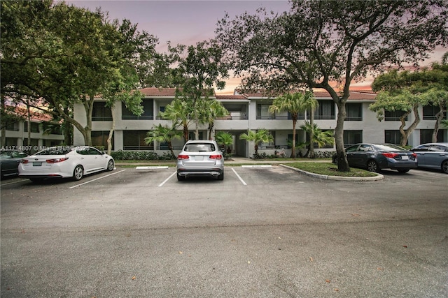 view of outdoor building at dusk