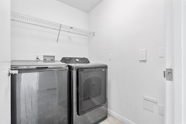3340 NE 190th St Unit 1206, Aventura, FL 33180 - laundry room with washing machine and clothes dryer, baseboards, and laundry area