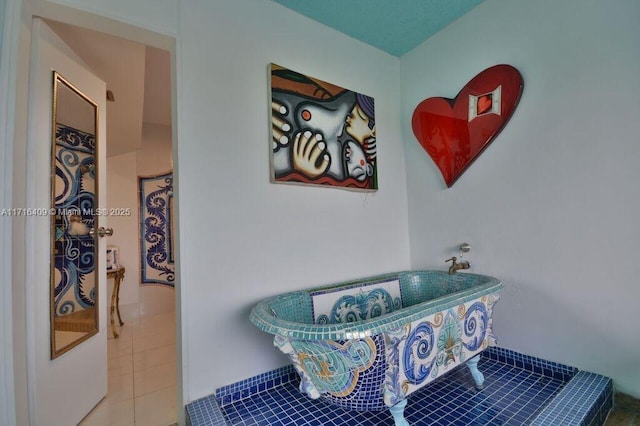 7801 NE 4th Ct Unit 317, Miami, FL 33138 - full bathroom with a freestanding bath and tile patterned flooring