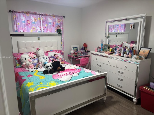 bedroom with dark wood-type flooring