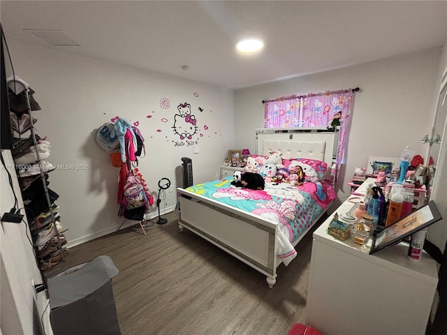 bedroom featuring a closet and wood-type flooring