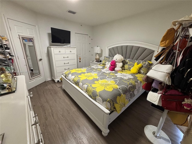 bedroom featuring dark hardwood / wood-style flooring