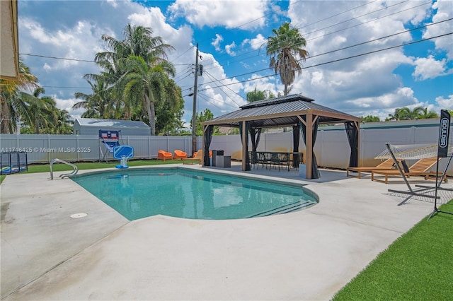 view of swimming pool with a gazebo and a patio area