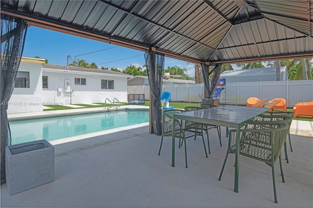 view of swimming pool featuring a gazebo and a patio