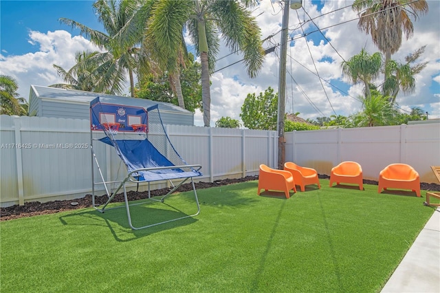 view of jungle gym featuring a trampoline and a yard