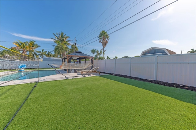 view of yard featuring a gazebo and a fenced in pool