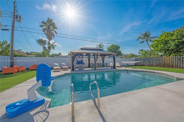 view of swimming pool featuring a gazebo and a patio area