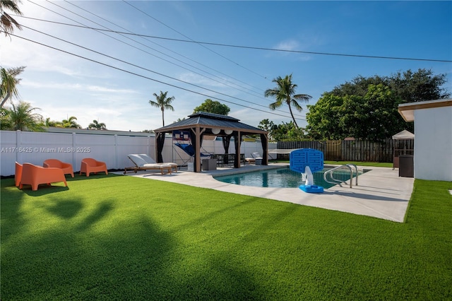 view of pool with a gazebo, a yard, and a patio